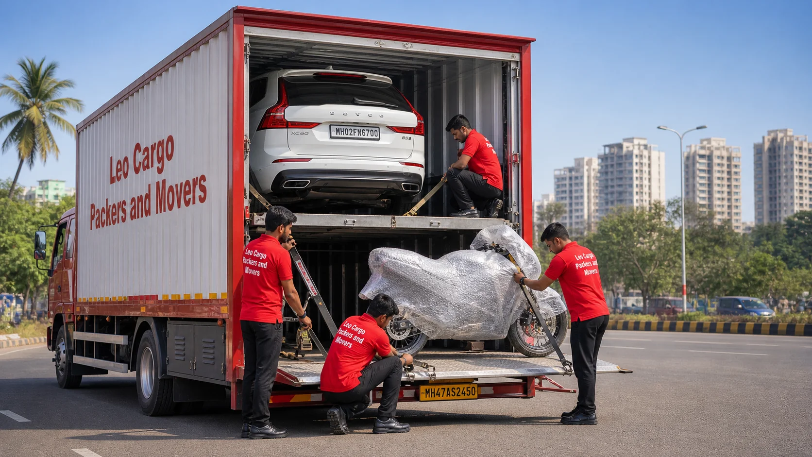 A specialized enclosed vehicle carrier truck on a wide Indian road - Leo Cargo Packers and Movers
