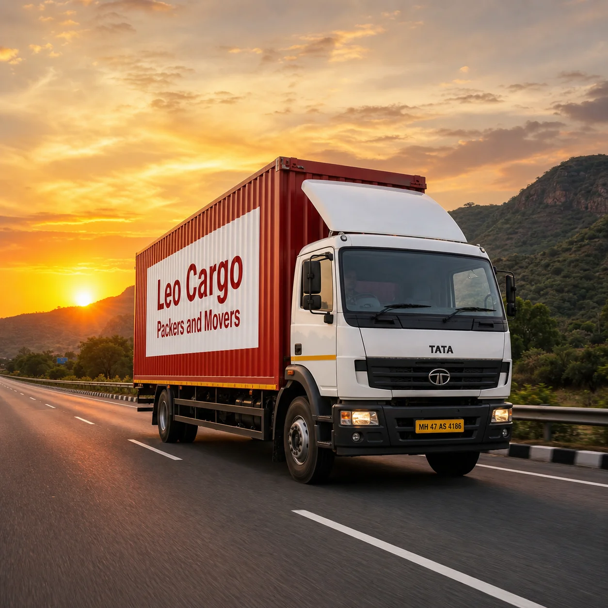 Wide view of a truck driving on a beautiful Indian highway at sunset - Leo Cargo Packers and Movers